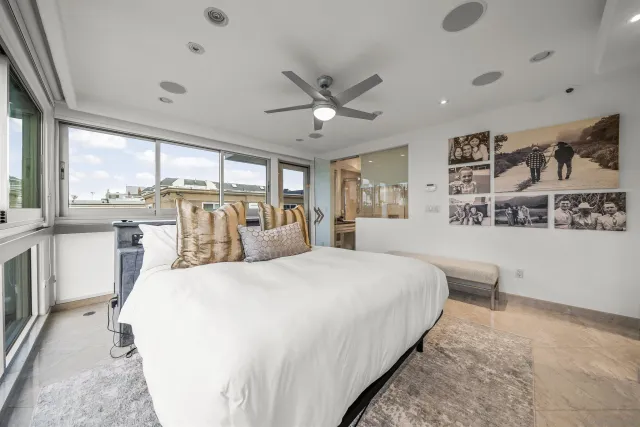 a view of a bathroom with a tub and a large window