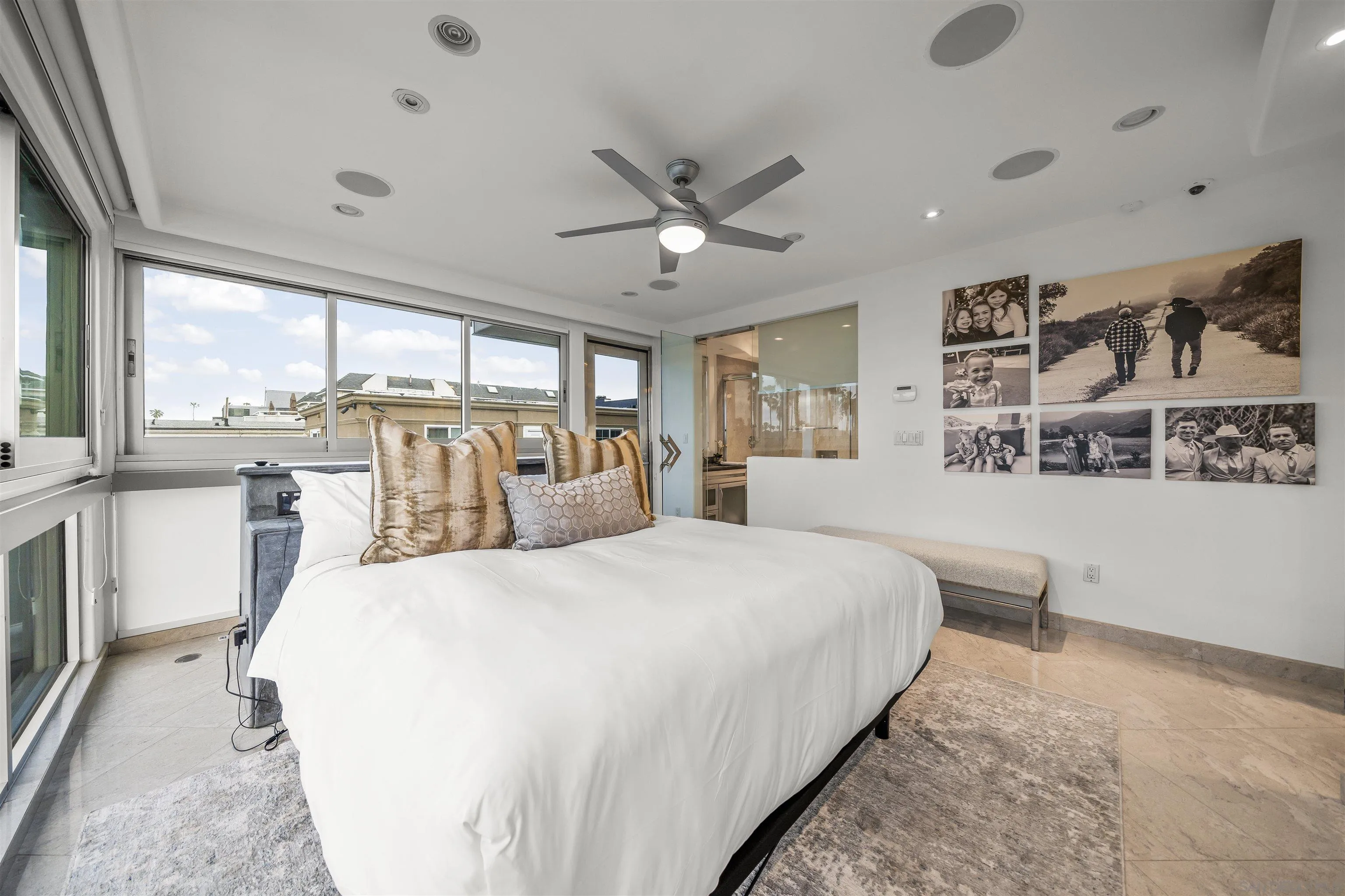 2999 Ocean Front Walk, Unit 2 San Diego, CA 92109 - Photo 13 of 25 a spacious bedroom with a large bed and a large window