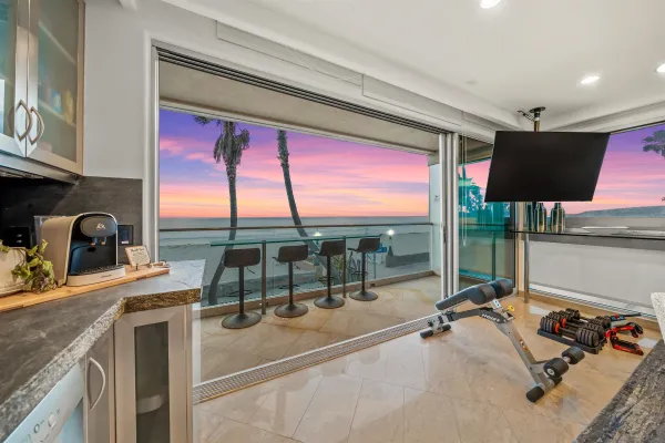 a room with gym equipment and a large window