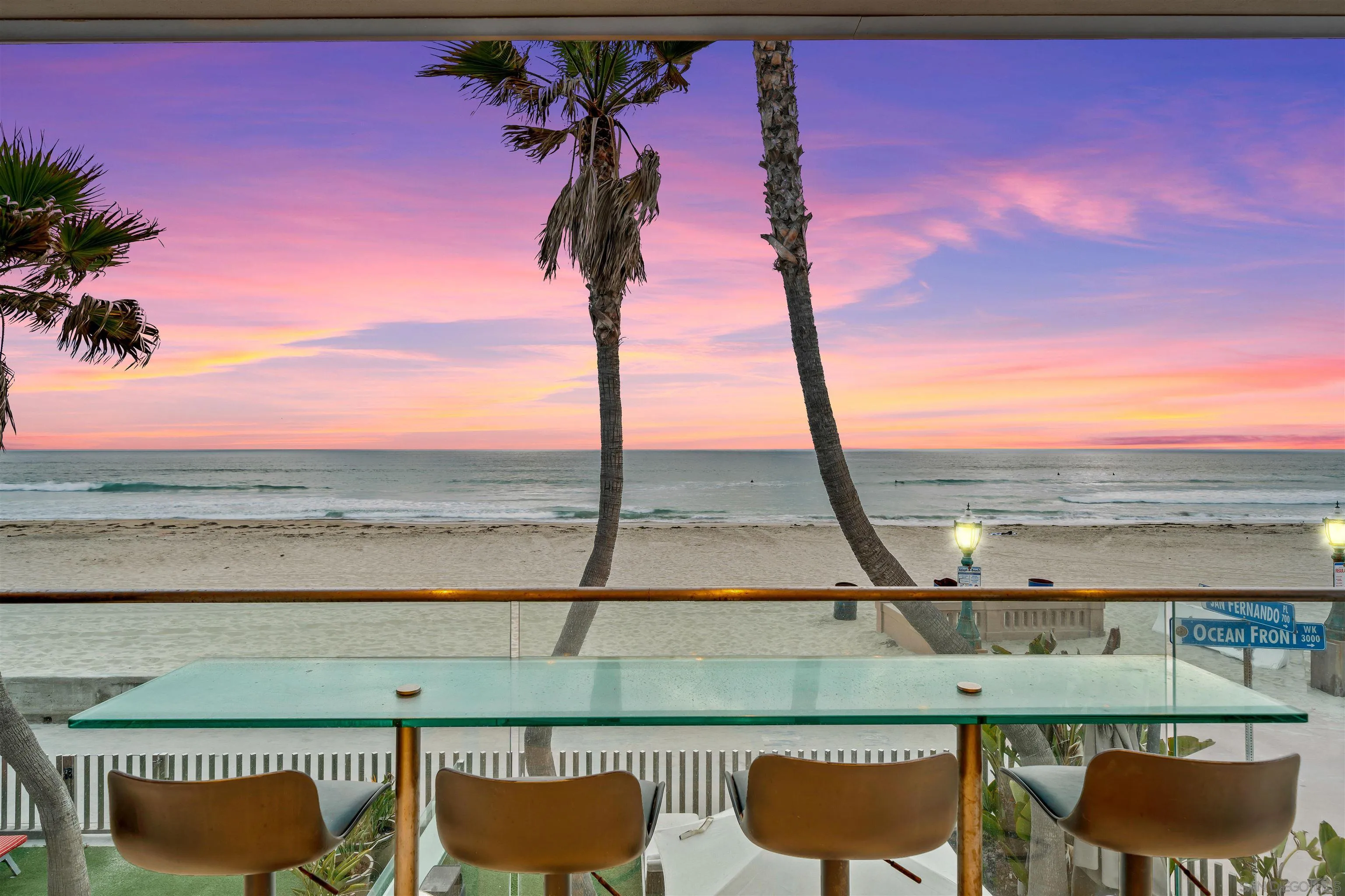 2999 Ocean Front Walk, Unit 2 San Diego, CA 92109 - Photo 4 of 25 a view of a lake with a table and chairs
