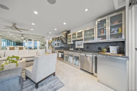 a kitchen with stainless steel appliances granite countertop a stove and a refrigerator