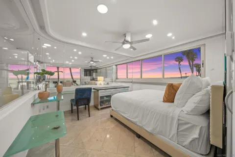 a large bedroom with a bed and a table