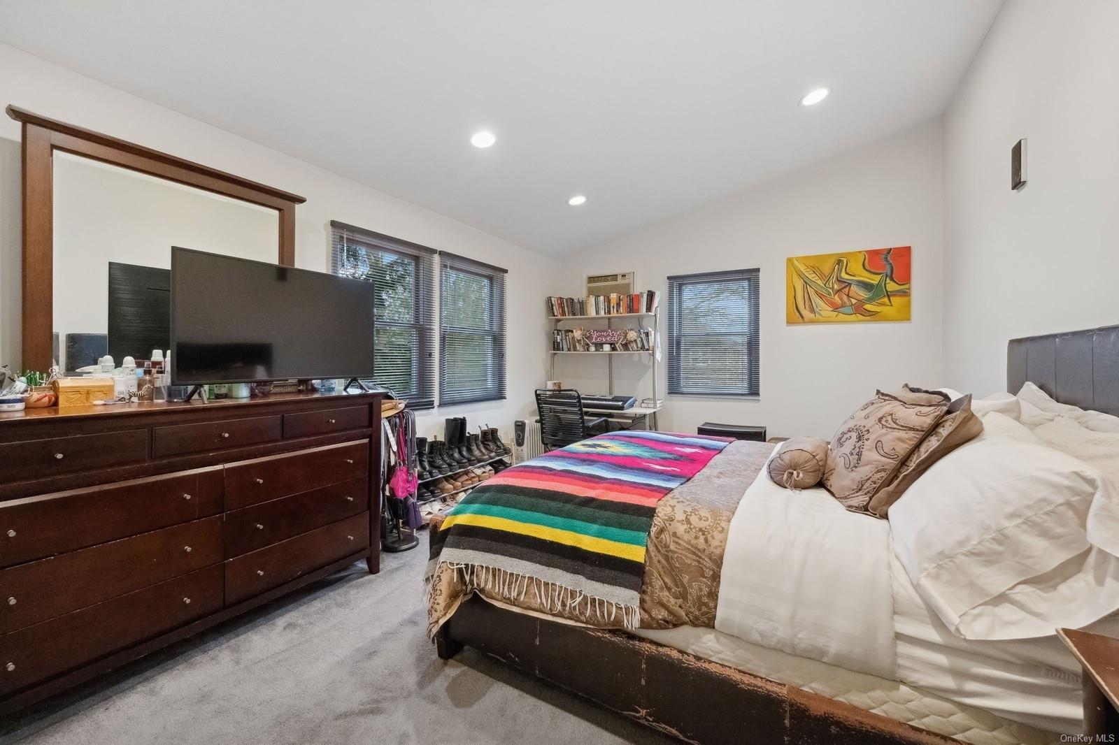 32 Harvard Avenue Hewlett, NY 11557 - Photo 22 of 42 Bedroom 3 featuring light colored carpet and lofted ceiling