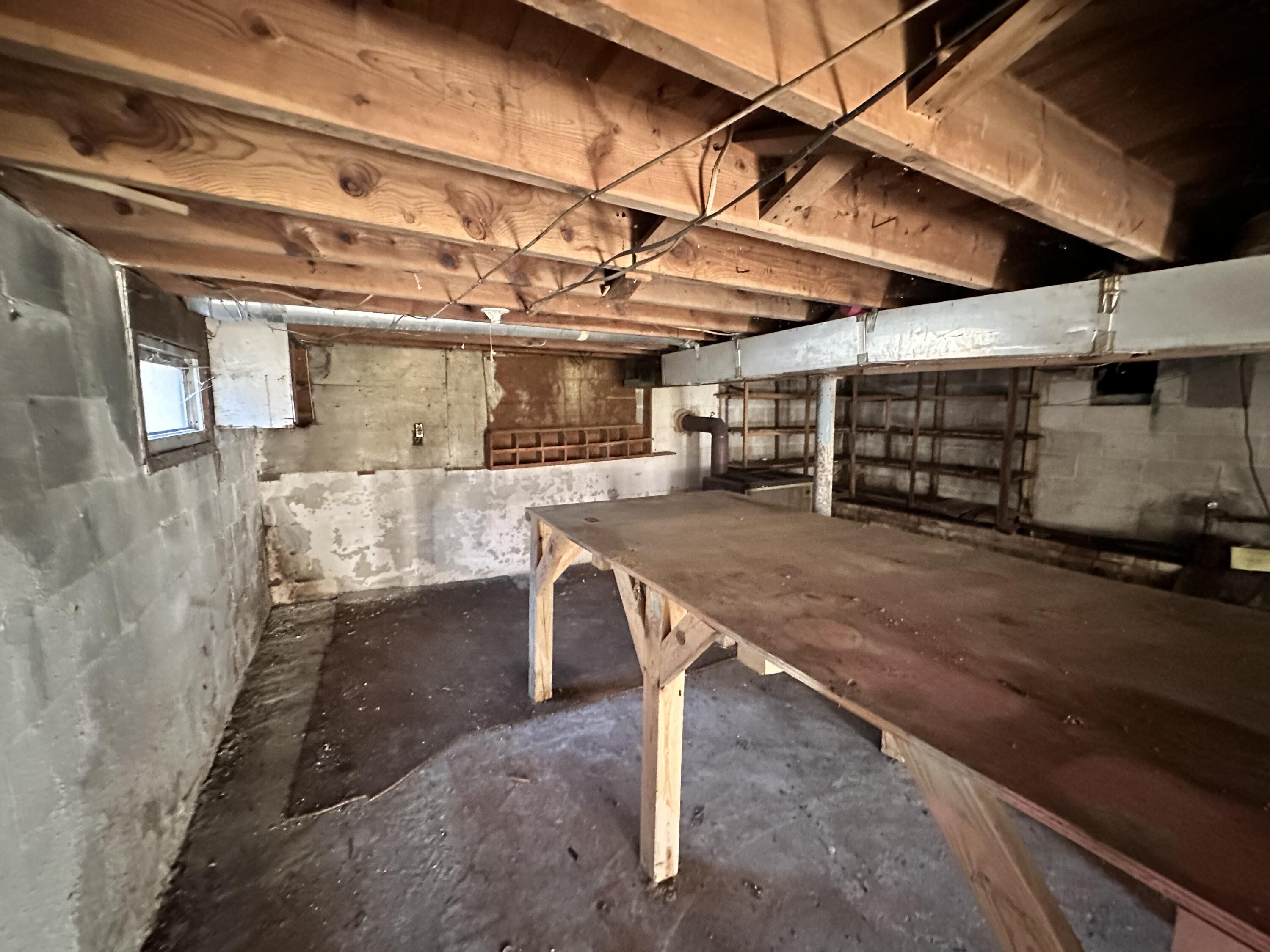 204 Ambrose Road Elliston, VA 24087 - Photo 17 of 19 a view of a room with wooden shelves