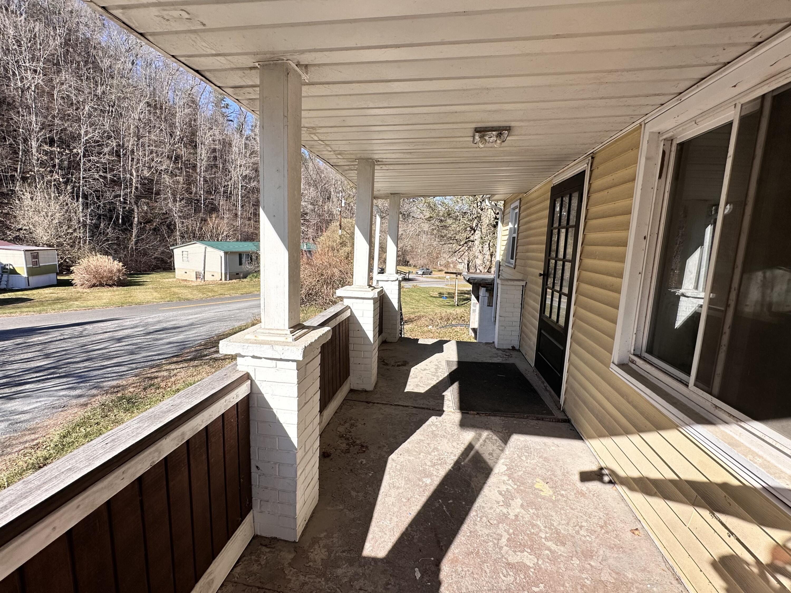 204 Ambrose Road Elliston, VA 24087 - Photo 4 of 19 a view of a balcony with chairs