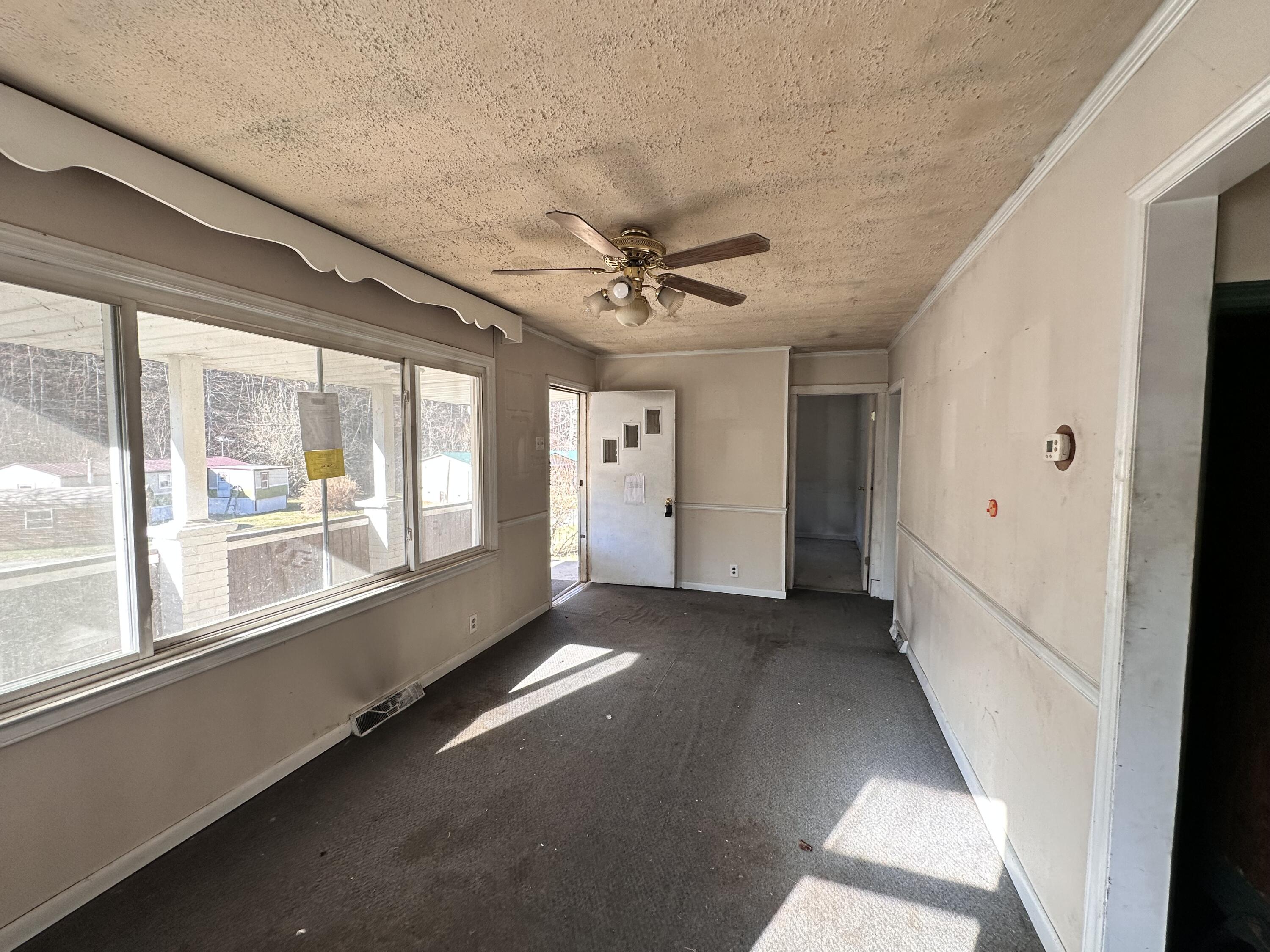 204 Ambrose Road Elliston, VA 24087 - Photo 9 of 19 a view of an empty room with a window