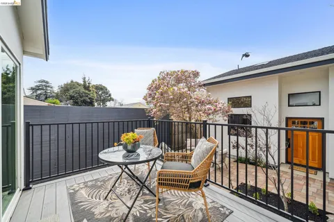 a view of balcony with wooden floor