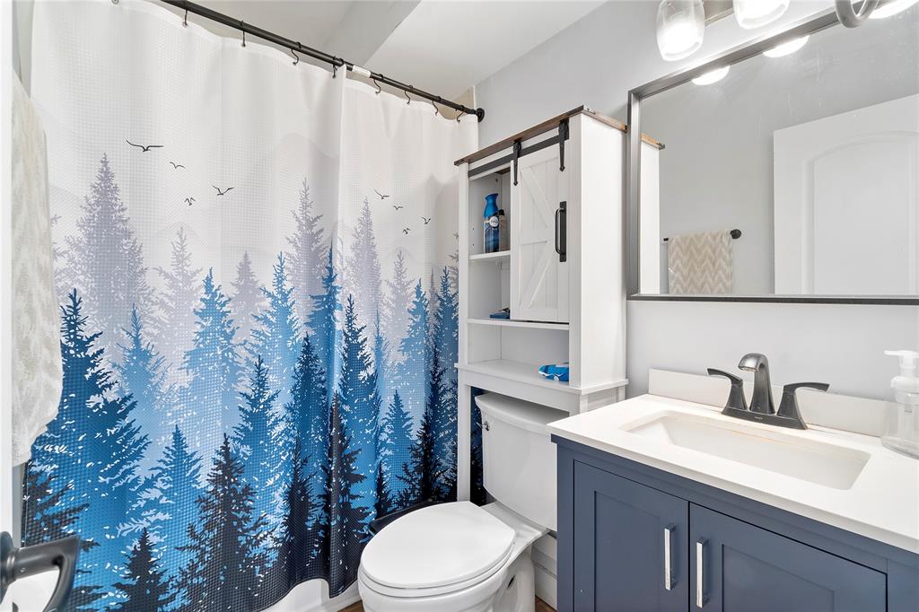 3030 Northeast 5th Terrace, Unit 1 Wilton Manors, FL 33334 - Photo 11 of 22 a bathroom with a sink toilet and shower