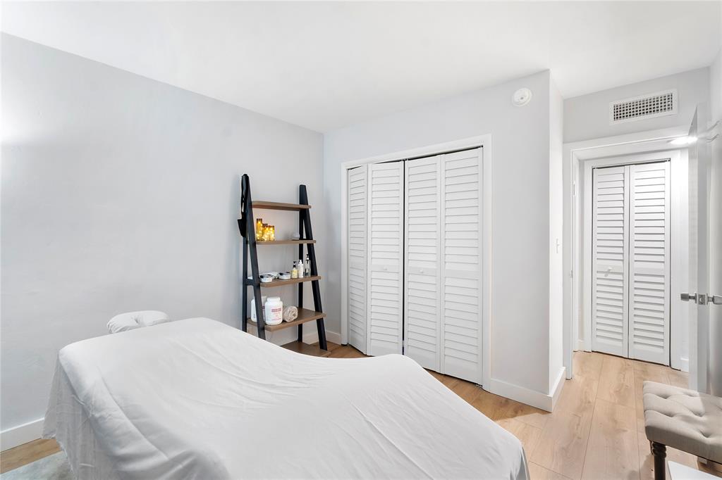 3030 Northeast 5th Terrace, Unit 1 Wilton Manors, FL 33334 - Photo 13 of 22 a bedroom with a bed and a window