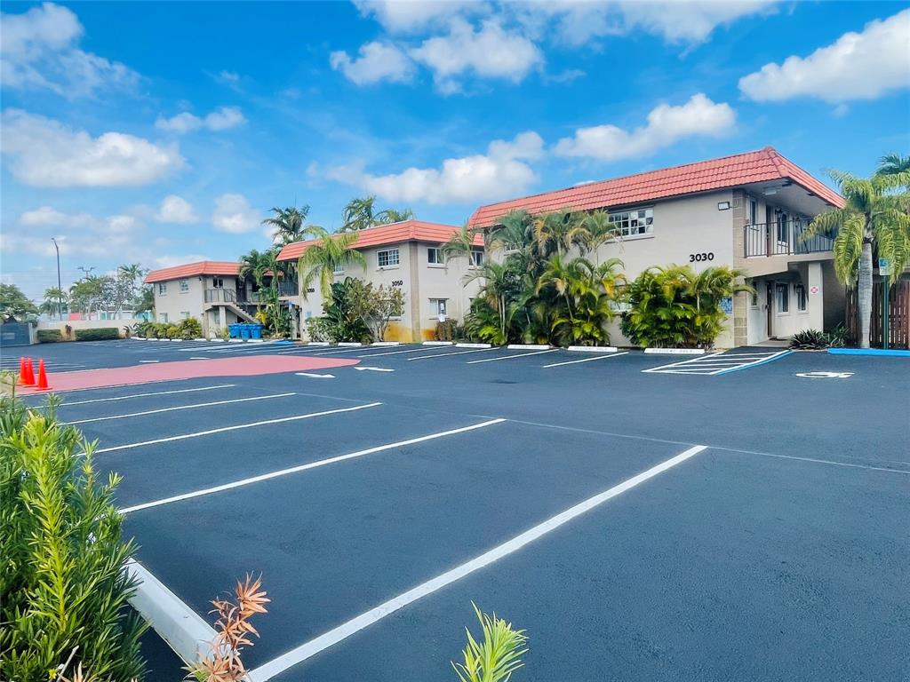 3030 Northeast 5th Terrace, Unit 1 Wilton Manors, FL 33334 - Photo 18 of 22 a view of a tennis court