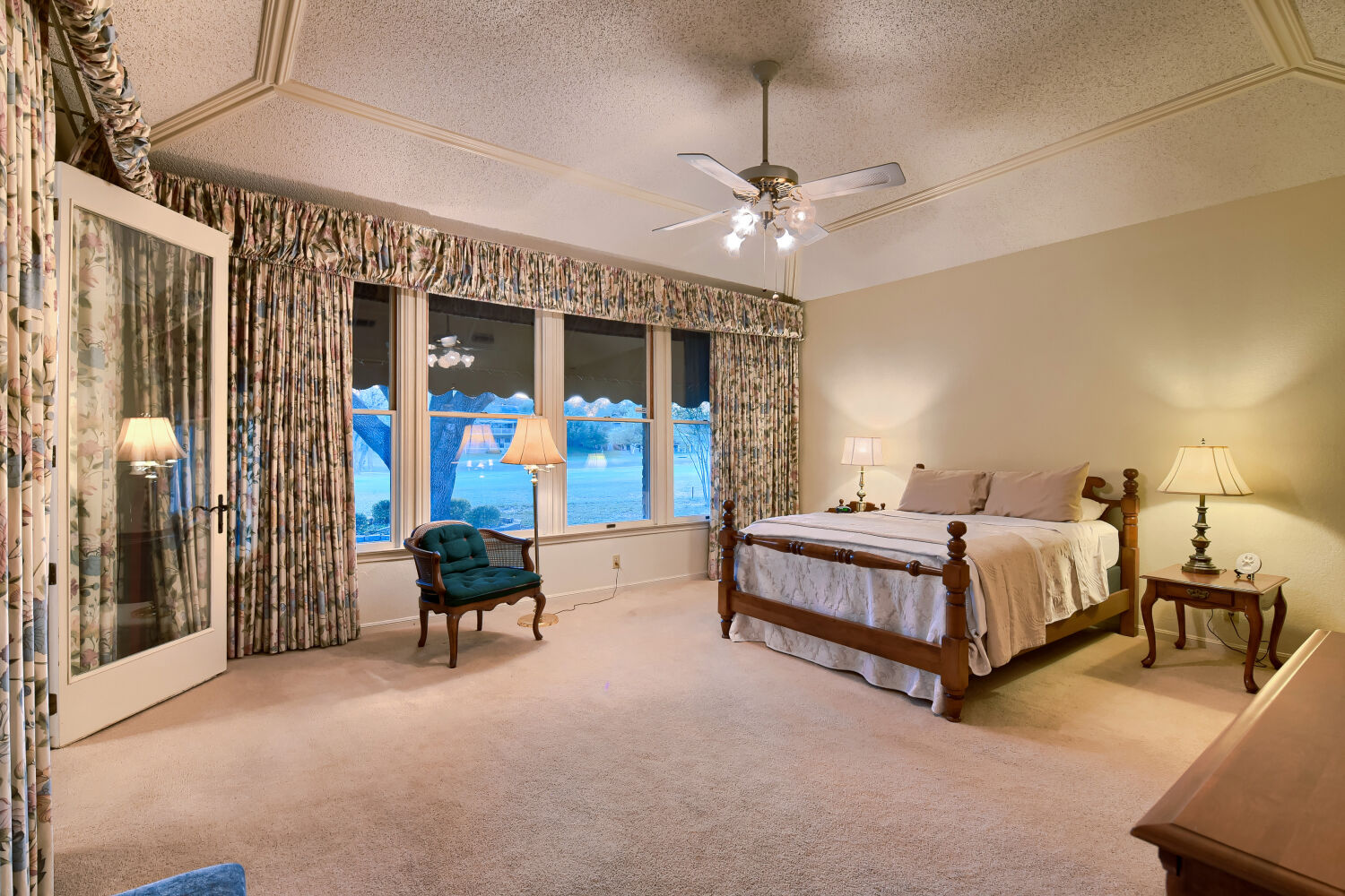 10904 Legends Lane Austin, TX 78747 - Photo 24 of 38 Large primary bedroom with vaulted ceilings. Beautiful full windows with backyard views.