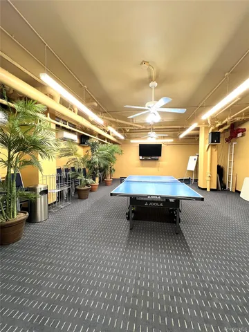 a swimming pool with outdoor seating and yard