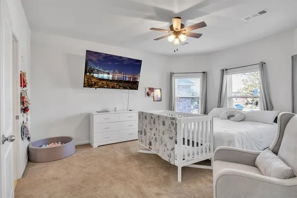 a bed room with furniture and a window