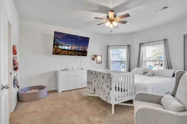 a bed room with furniture and a window