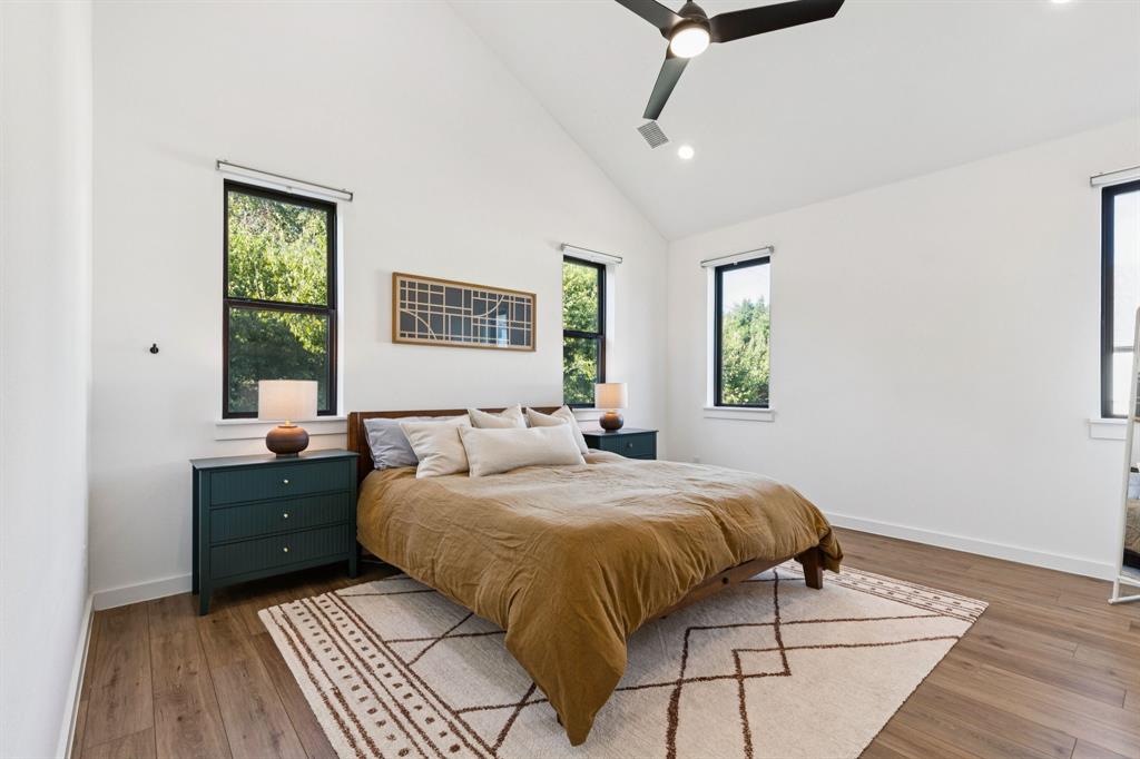 2291 Rook Drive Dallas, TX 75211 - Photo 12 of 26 a bedroom with a large bed and a window