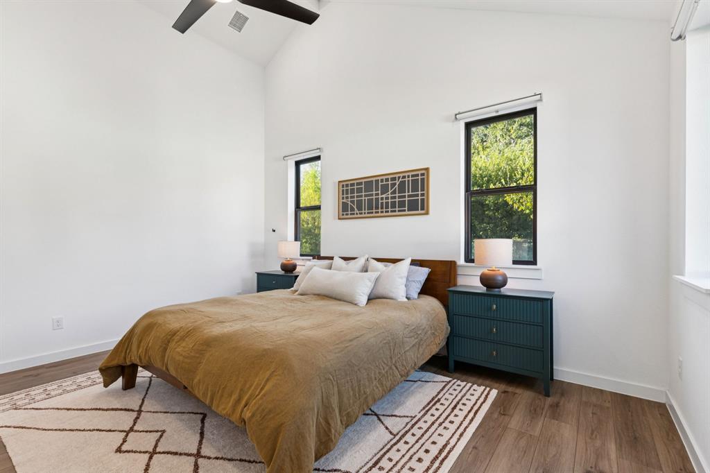 2291 Rook Drive Dallas, TX 75211 - Photo 13 of 26 a bedroom with a bed and a window