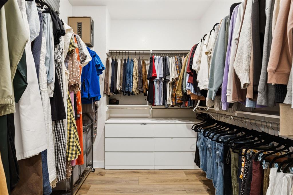 2291 Rook Drive Dallas, TX 75211 - Photo 17 of 26 a view of walk in closet with clothes and shoes