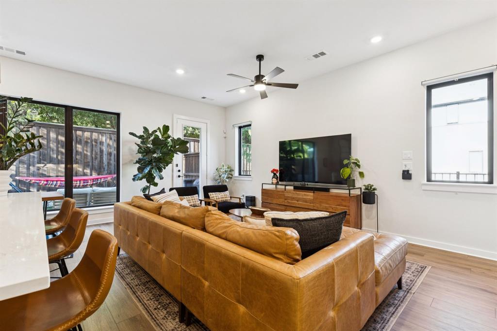 2291 Rook Drive Dallas, TX 75211 - Photo 4 of 26 a living room with furniture and a flat screen tv