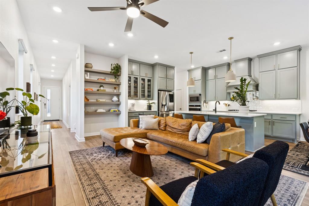 2291 Rook Drive Dallas, TX 75211 - Photo 6 of 26 a living room with furniture kitchen view and a chandelier