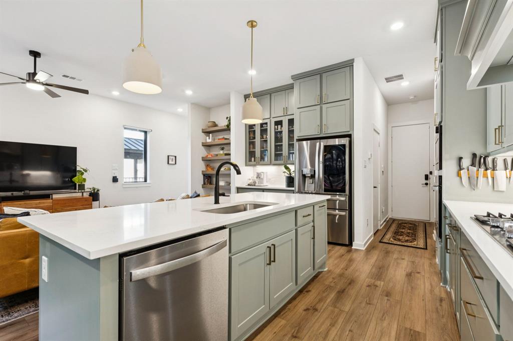 2291 Rook Drive Dallas, TX 75211 - Photo 9 of 26 a kitchen with a sink appliances and cabinets