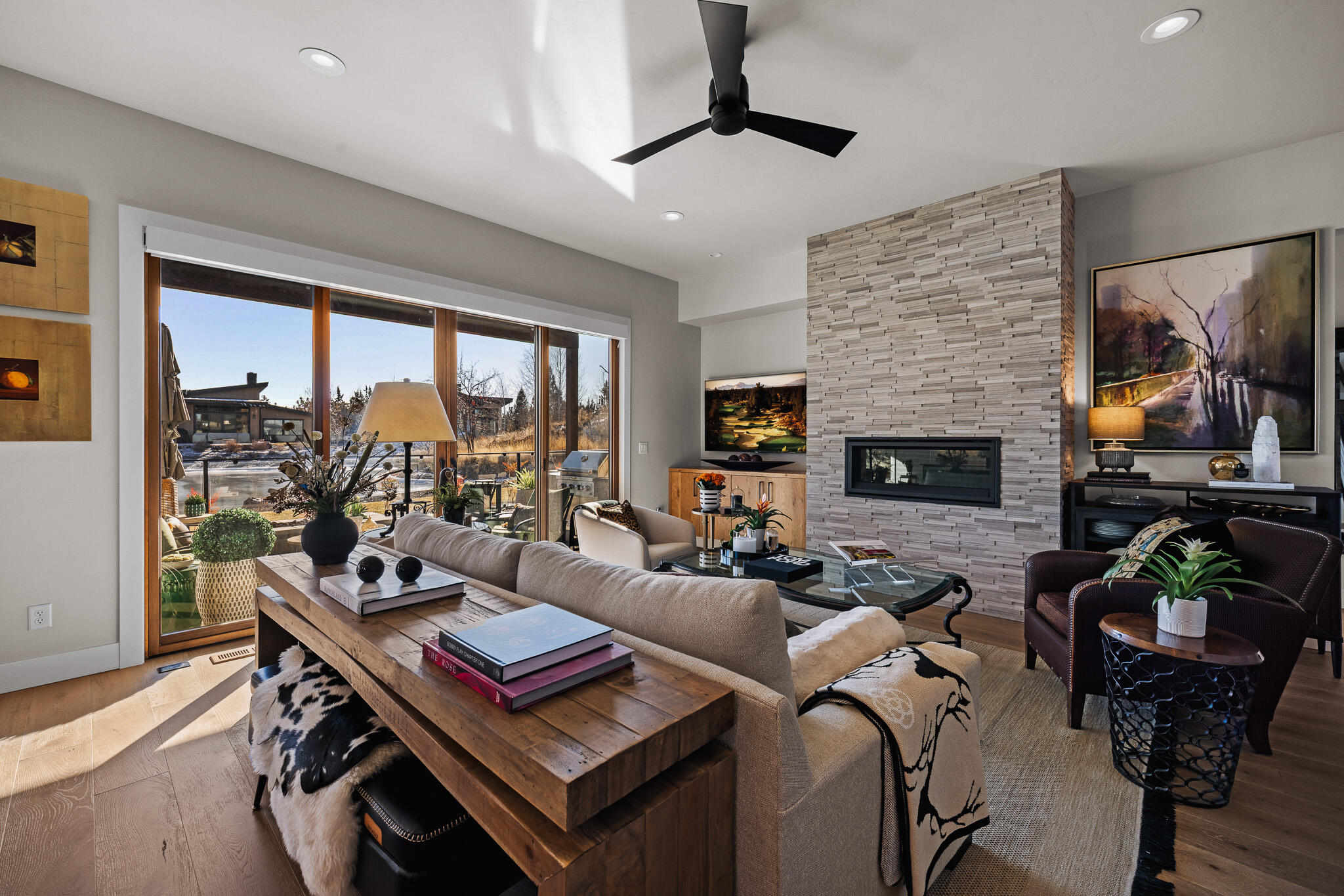 22993 Ghost Tree Lane Bend, OR 97701 - Photo 11 of 35 a living room with furniture fireplace and a large window