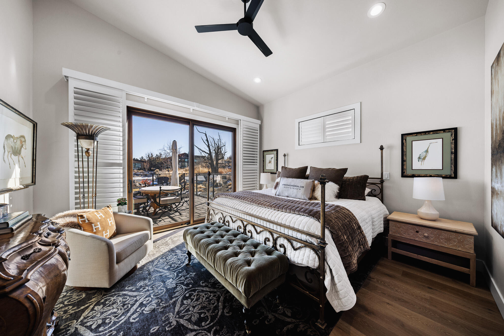 22993 Ghost Tree Lane Bend, OR 97701 - Photo 14 of 35 a bedroom with a bed and glass window