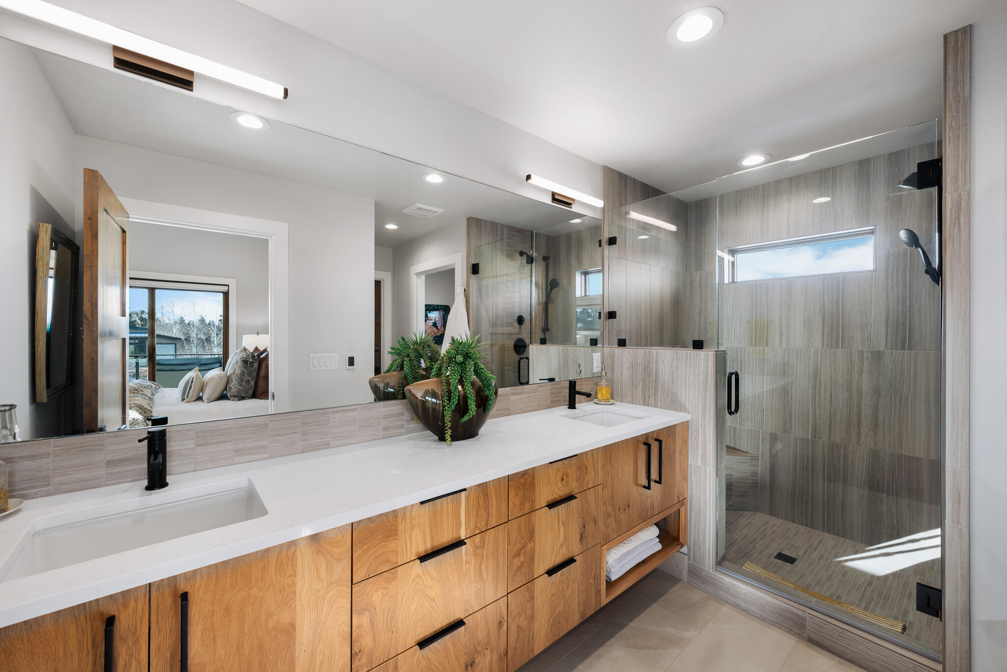 22993 Ghost Tree Lane Bend, OR 97701 - Photo 21 of 35 a bathroom with a granite countertop sink mirror and shower