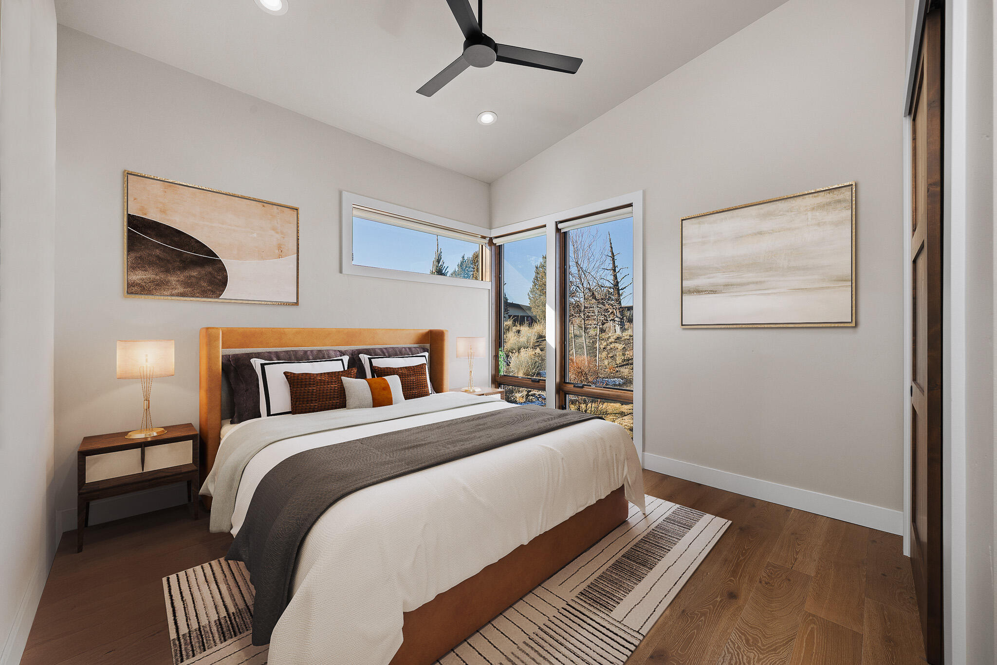 22993 Ghost Tree Lane Bend, OR 97701 - Photo 23 of 35 a bedroom with a bed and wooden floor