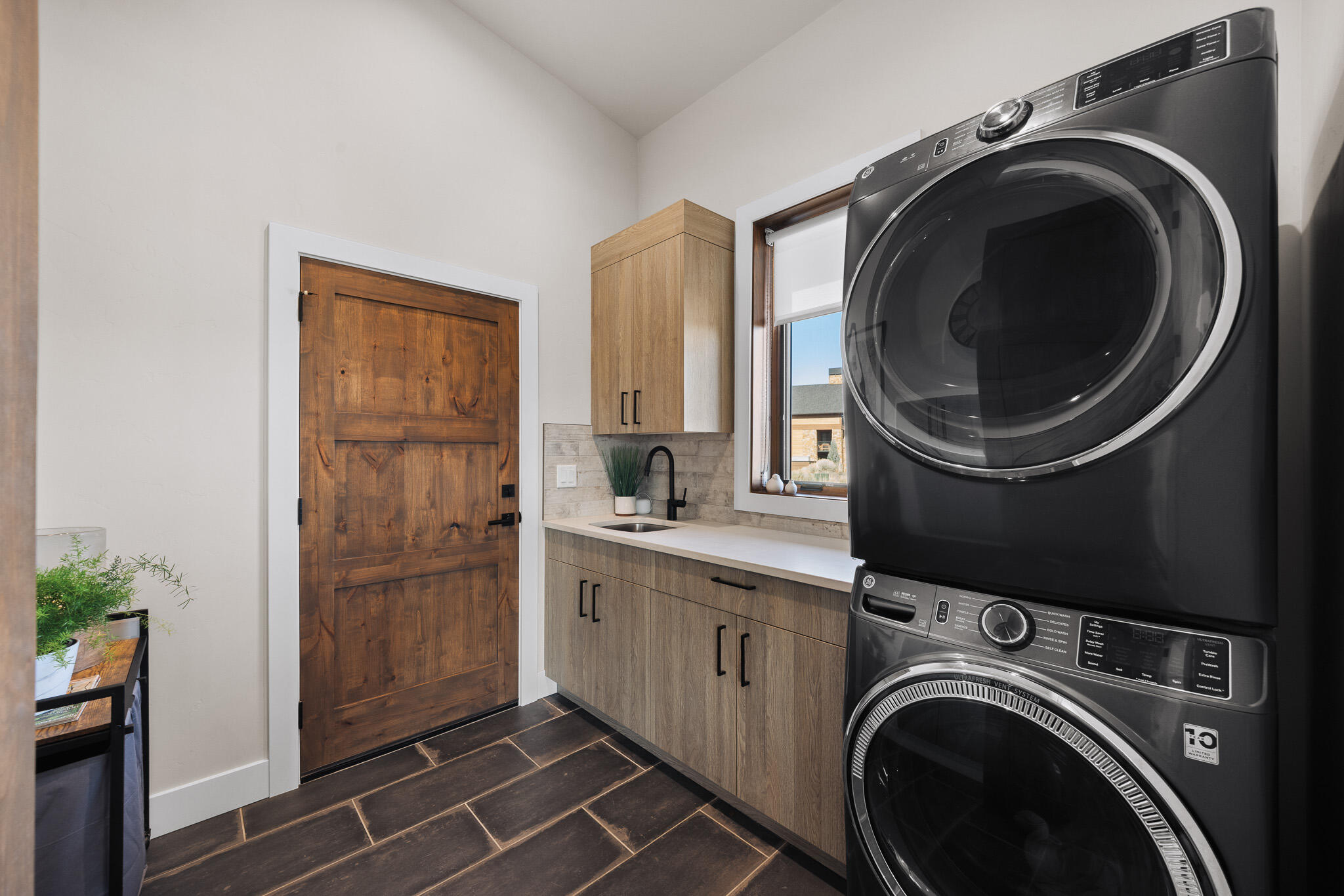 22993 Ghost Tree Lane Bend, OR 97701 - Photo 26 of 35 a utility room with sink dryer and washer