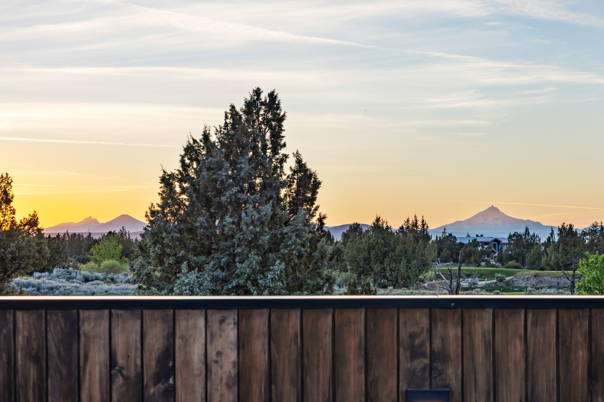 22993 Ghost Tree Lane Bend, OR 97701 - Photo 31 of 35 a view of a balcony with wooden fence and floor