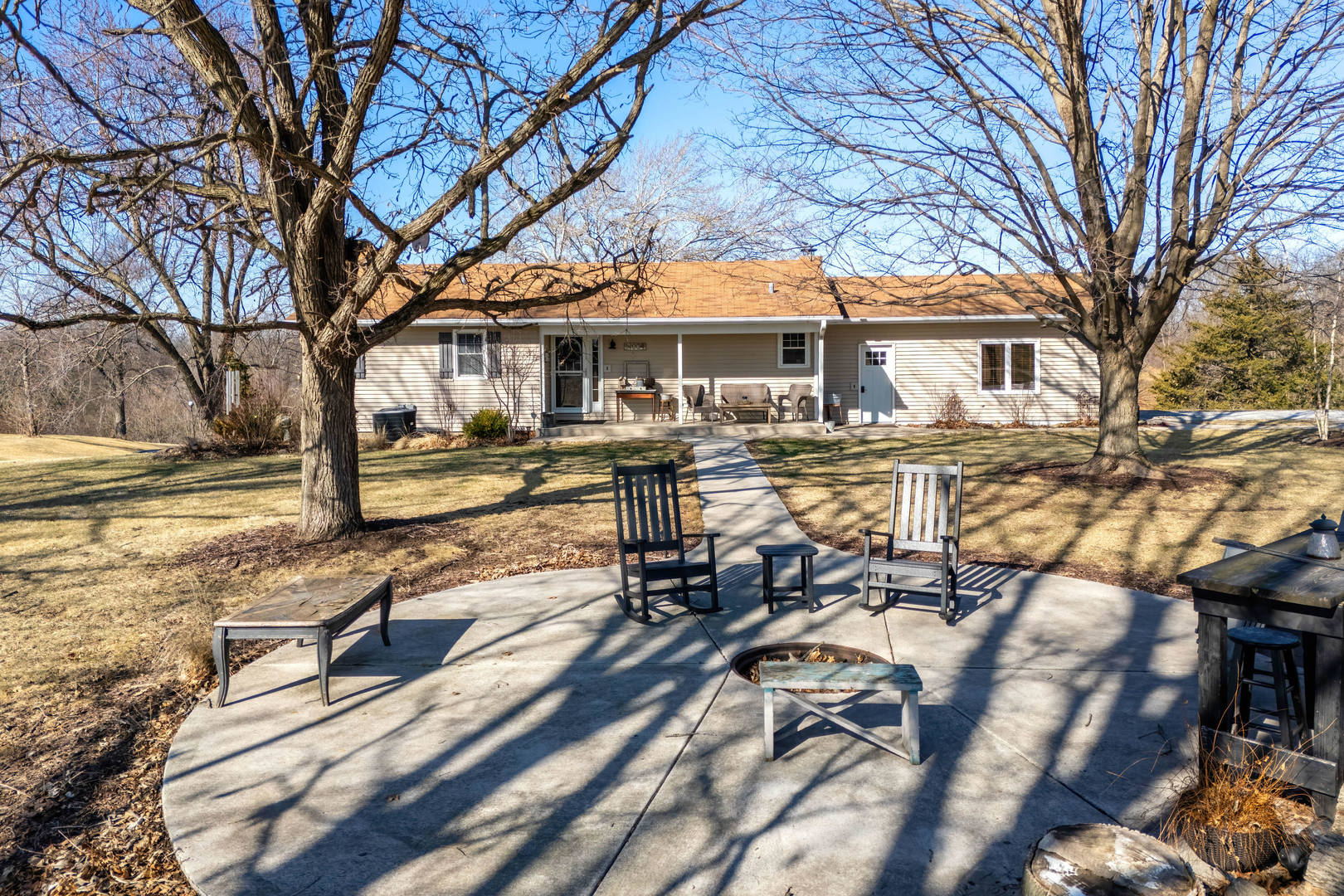 14004 252nd Street West Illinois City, IL 61259 - Photo 16 of 49 a view of a patio with table and chairs under an tree