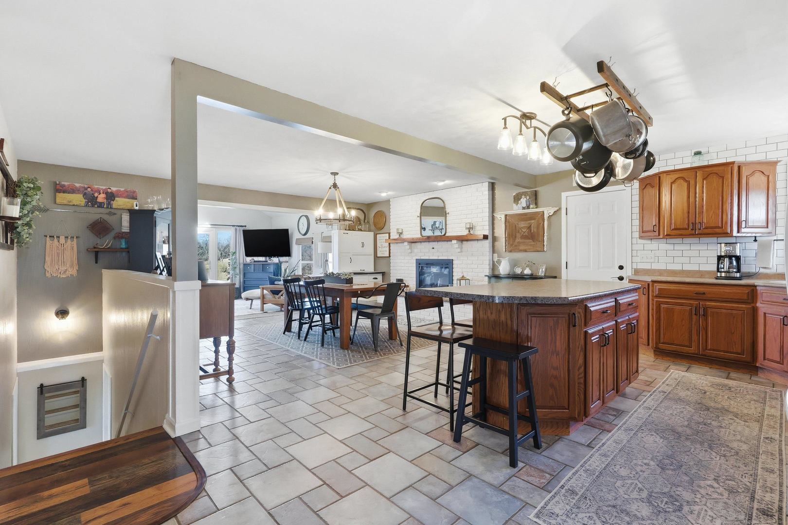 14004 252nd Street West Illinois City, IL 61259 - Photo 18 of 49 a kitchen with stainless steel appliances granite countertop a stove top oven a sink dishwasher a dining table and chairs with wooden floor