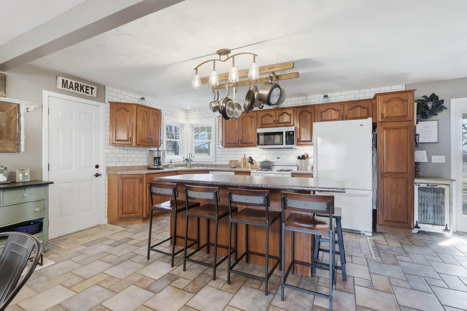 14004 252nd Street West Illinois City, IL 61259 - Photo 21 of 49 a kitchen with stainless steel appliances a table and chairs in it