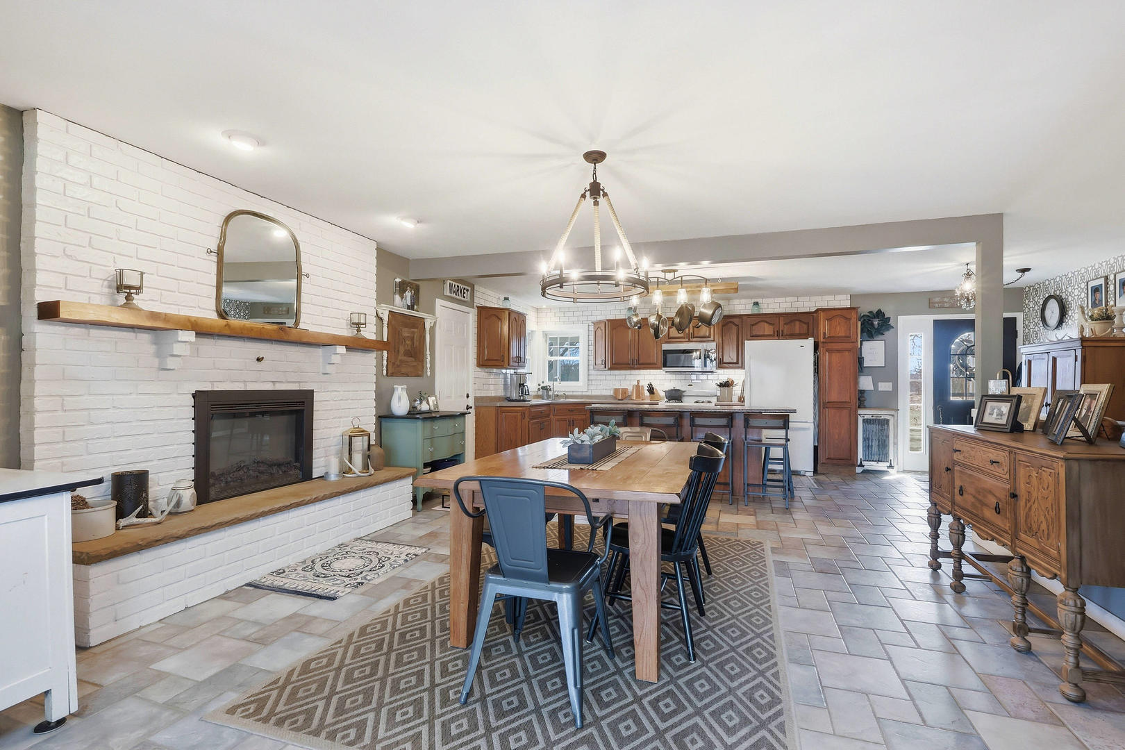 14004 252nd Street West Illinois City, IL 61259 - Photo 25 of 49 a dining room with furniture a rug and a fireplace