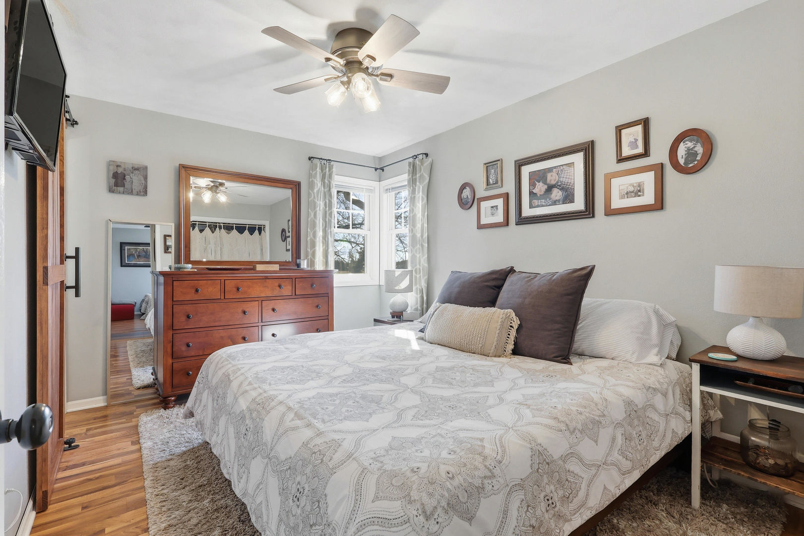 14004 252nd Street West Illinois City, IL 61259 - Photo 29 of 49 a bedroom with a bed and a chandelier