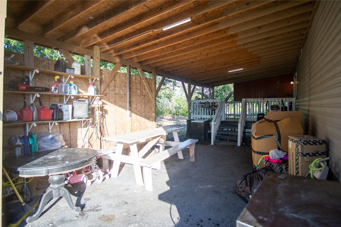 205 Arrowhead Cove Kyle, TX 78640 - Photo 15 of 20 a view of a chairs and table in a patio