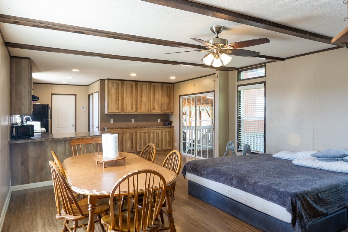 205 Arrowhead Cove Kyle, TX 78640 - Photo 3 of 20 a view of a dining room with furniture window and wooden floor