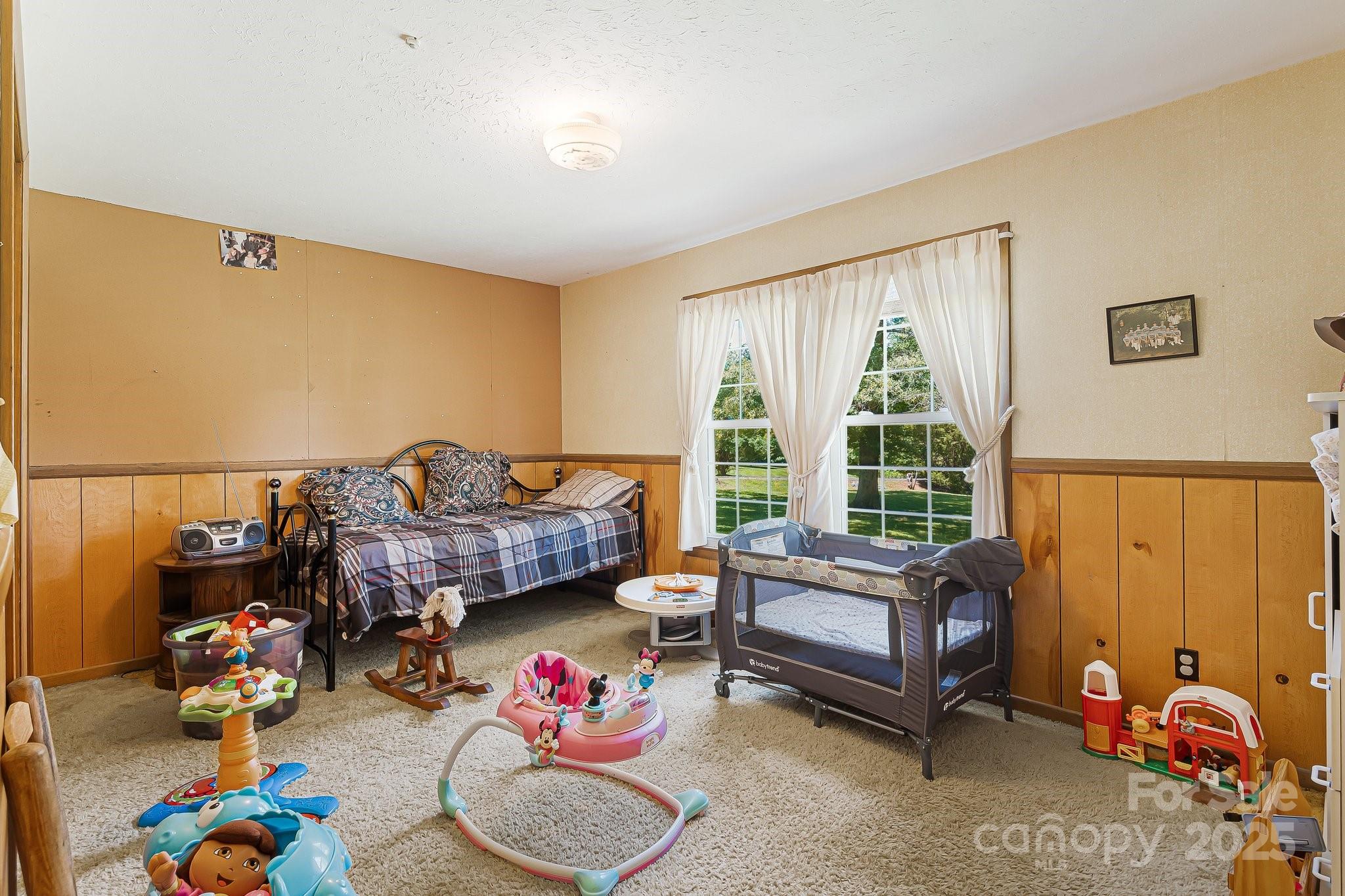 1361 Jack McKinney Road Rutherfordton, NC 28139 - Photo 25 of 46 a bedroom with furniture and a large window