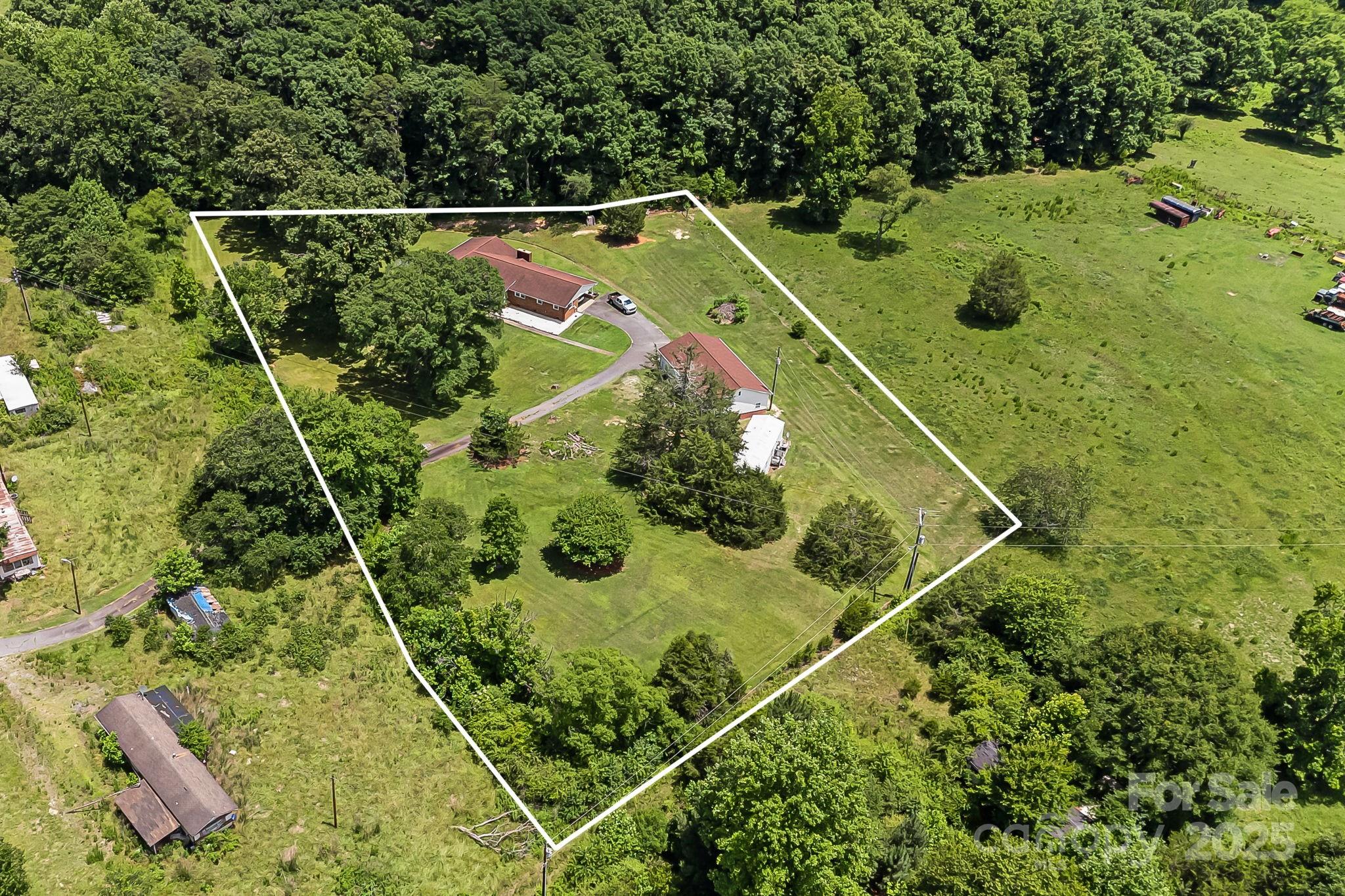 1361 Jack McKinney Road Rutherfordton, NC 28139 - Photo 3 of 46 an aerial view of a residential houses with outdoor space