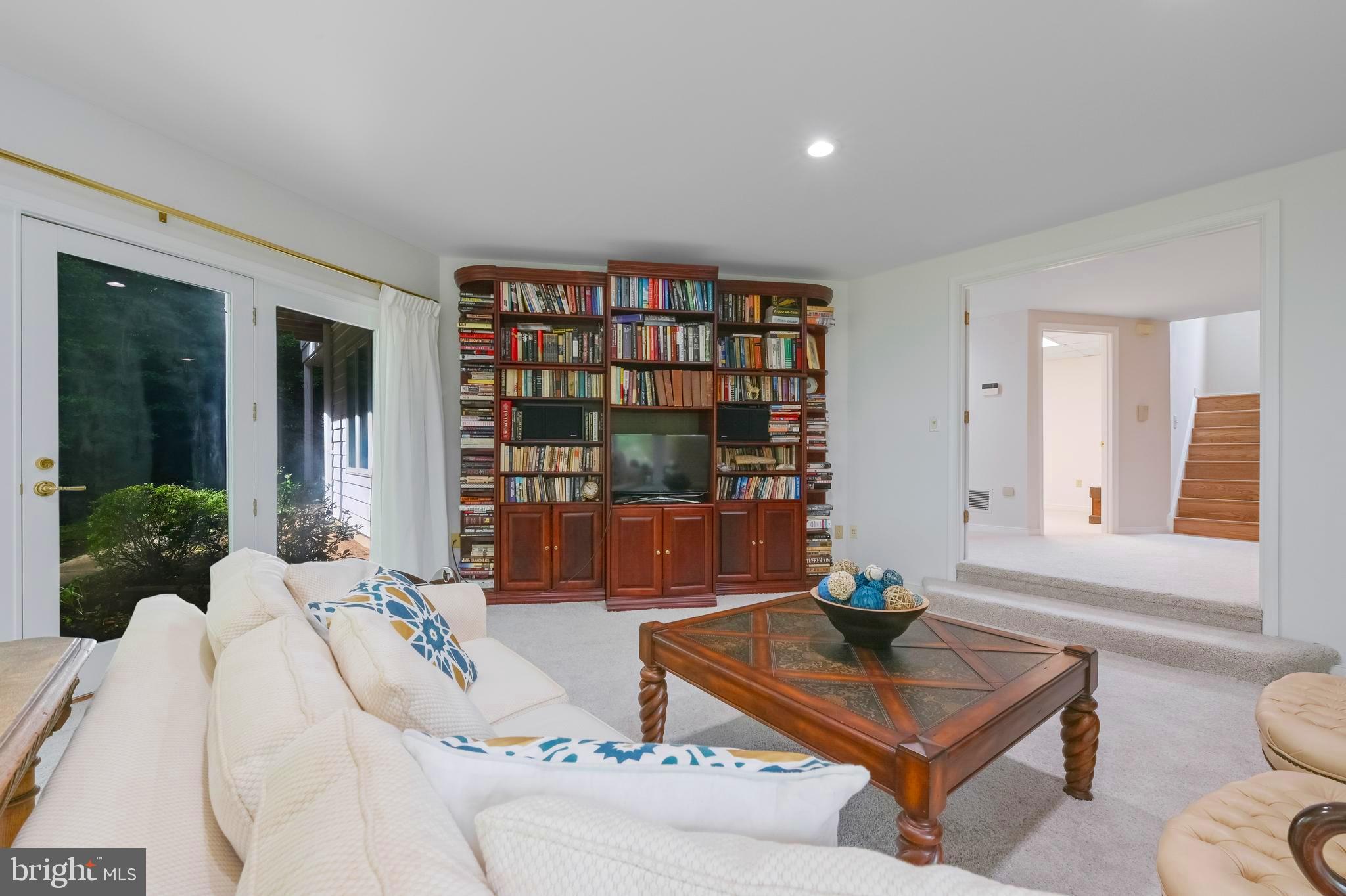557 Osprey Point Road Crownsville, MD 21032 - Photo 54 of 91 A hexagon shaped room with 3 sets of doors