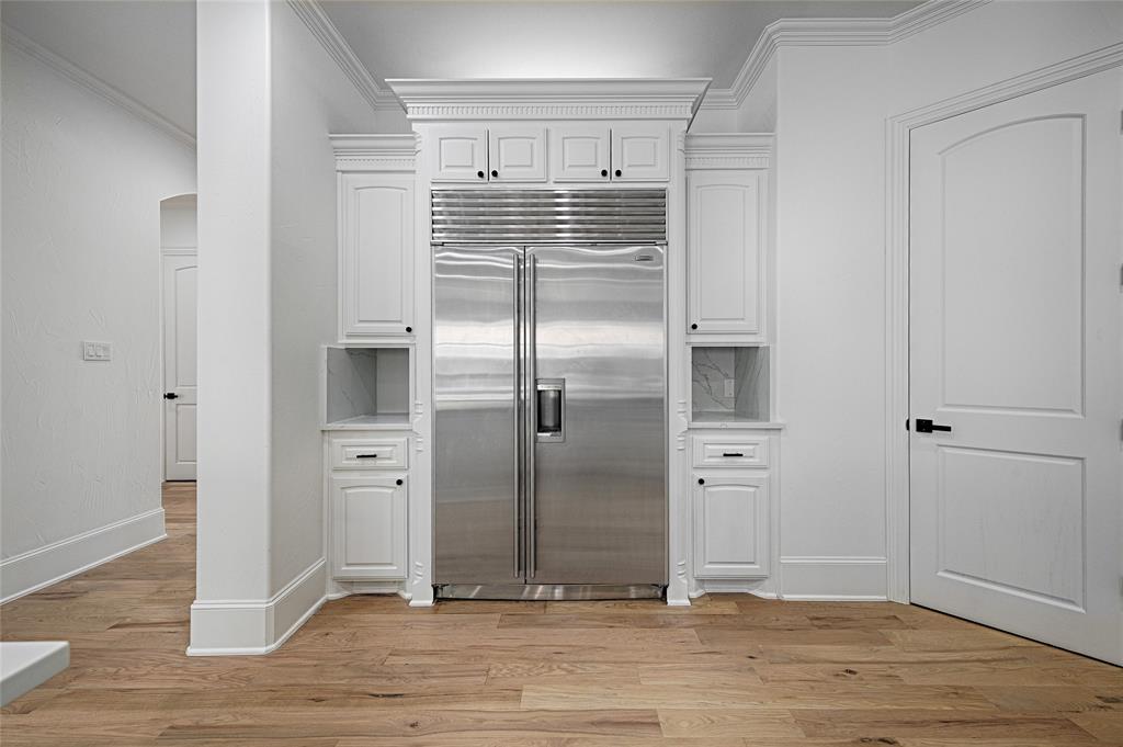 6301 Churchill Way Dallas, TX 75230 - Photo 17 of 40 an empty room with wooden floor and windows