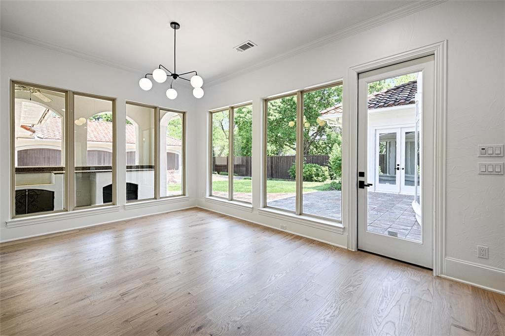 6301 Churchill Way Dallas, TX 75230 - Photo 20 of 40 a view of an empty room with wooden floor and a window