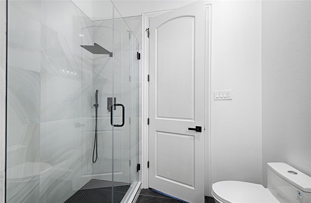 6301 Churchill Way Dallas, TX 75230 - Photo 34 of 40 a bathroom with a shower toilet and sink