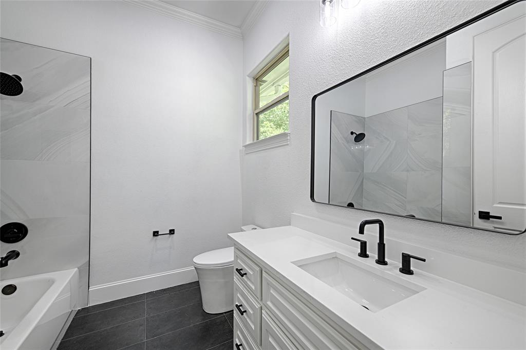 6301 Churchill Way Dallas, TX 75230 - Photo 37 of 40 a bathroom with a sink toilet tub and shower