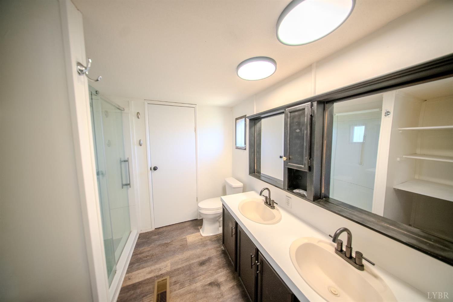 920 Hodnetts Road Gretna, VA 24557 - Photo 16 of 31 a bathroom with a sink and a mirror