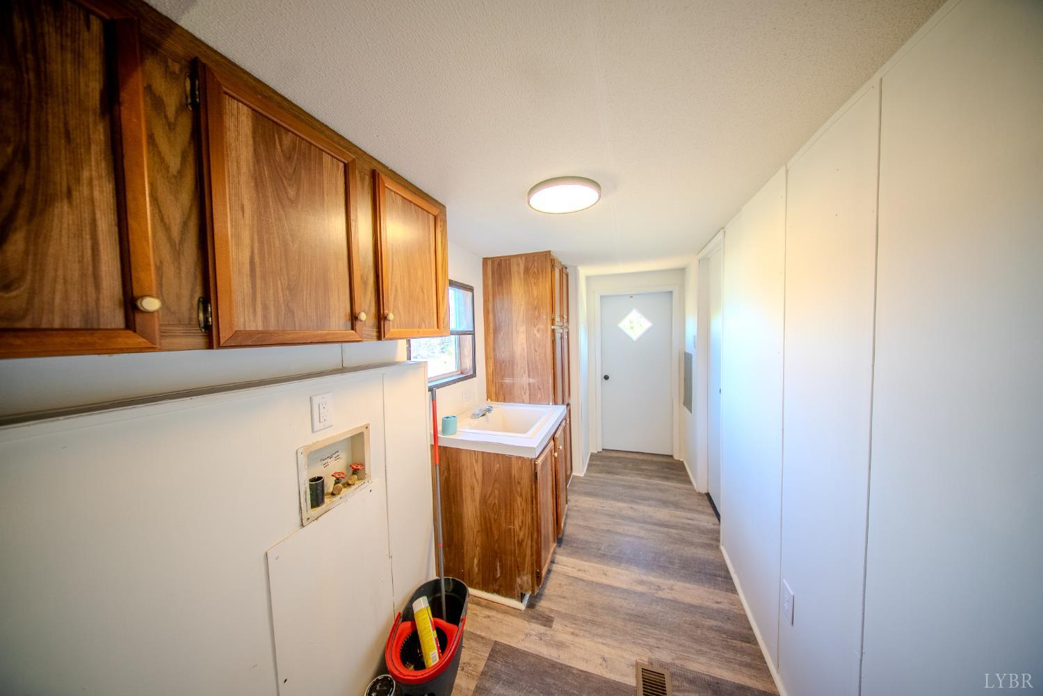 920 Hodnetts Road Gretna, VA 24557 - Photo 23 of 31 a view of a hallway with washer and dryer