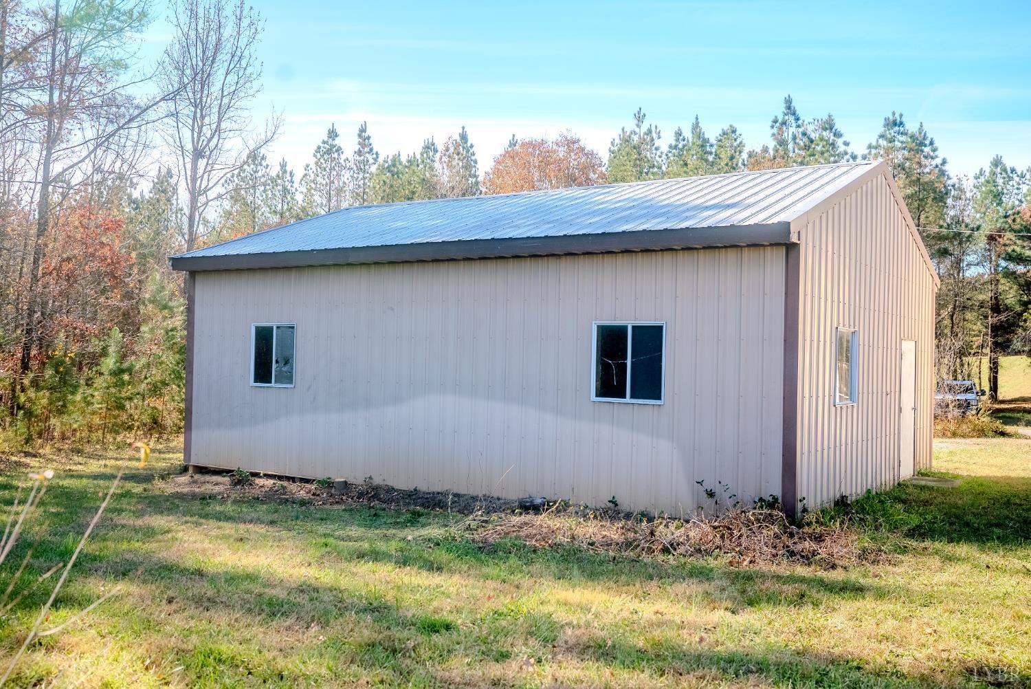 920 Hodnetts Road Gretna, VA 24557 - Photo 28 of 31 a house with trees in the background
