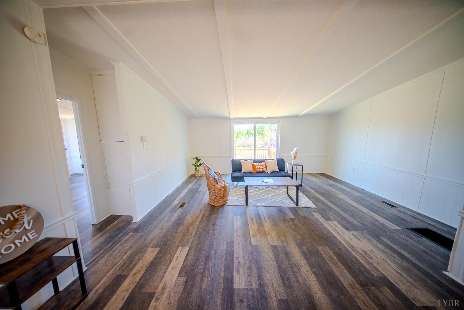 920 Hodnetts Road Gretna, VA 24557 - Photo 3 of 31 a living room with furniture and a wooden floor