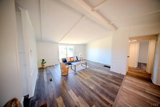 a view of a living room and hardwood floor