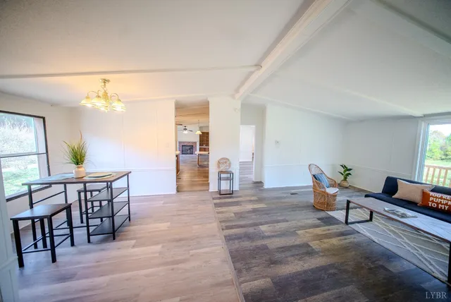 a view of a livingroom with furniture and windows